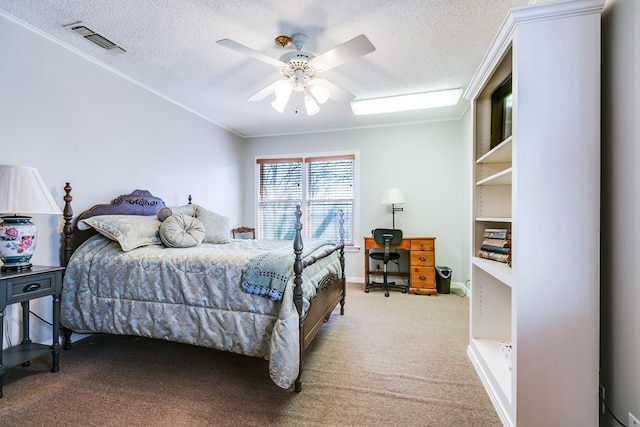 carpeted bedroom with crown molding, ceiling fan, and a textured ceiling