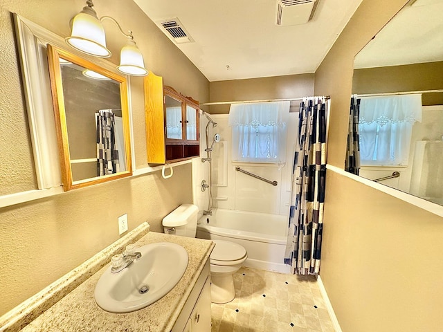 full bathroom with vanity, toilet, and shower / bath combo