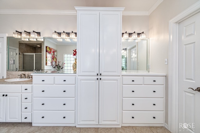 2141 Valleyview Dr, San Angelo, TX 76904 - bathroom featuring crown molding, a shower stall, vanity, and tile patterned floors