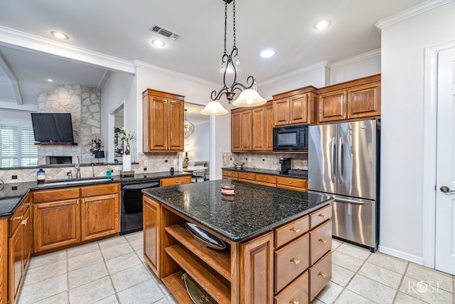 2141 Valleyview Dr, San Angelo, TX 76904 - kitchen featuring black appliances, a sink, open shelves, a center island, and tasteful backsplash