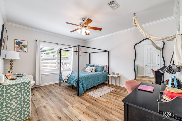 2141 Valleyview Dr, San Angelo, TX 76904 - bedroom with light wood-style flooring, ornamental molding, baseboards, and a ceiling fan