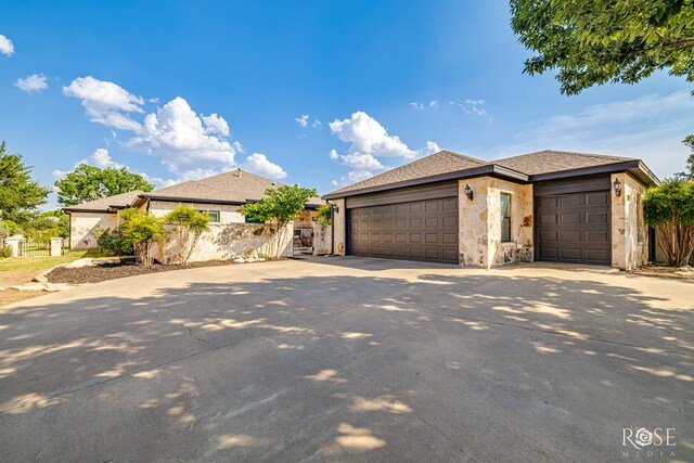 2141 Valleyview Dr, San Angelo, TX 76904 - view of front of house featuring a garage, concrete driveway, and a gate