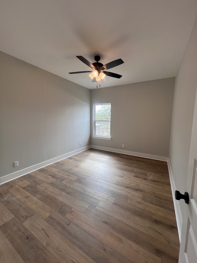 unfurnished room featuring hardwood / wood-style floors and ceiling fan