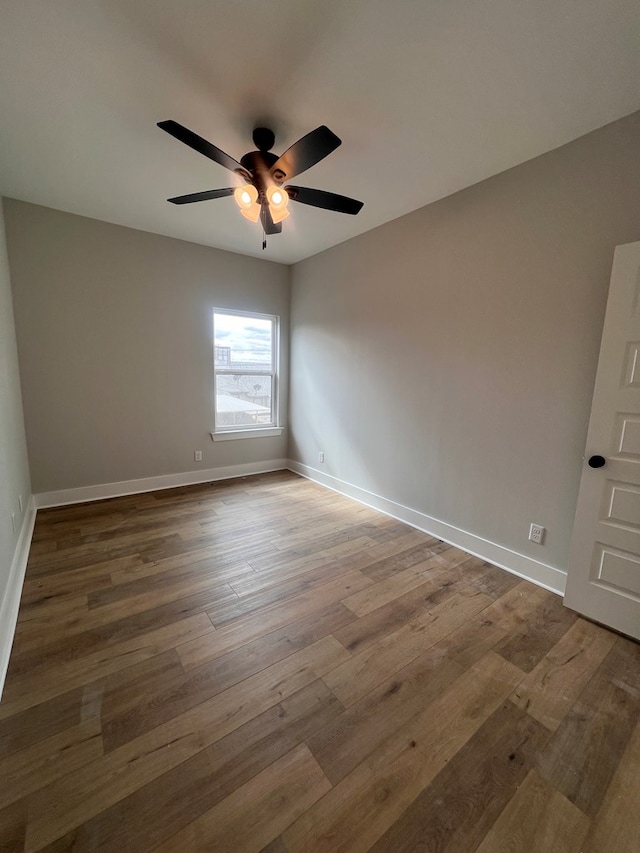 unfurnished room featuring wood-type flooring and ceiling fan