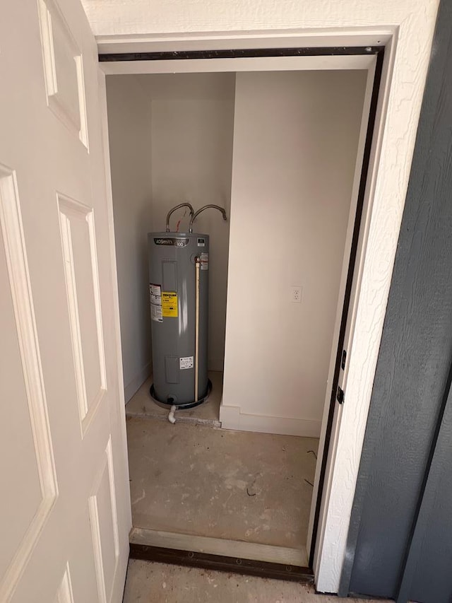 utility room featuring water heater