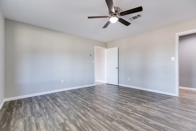 unfurnished room featuring dark hardwood / wood-style flooring and ceiling fan