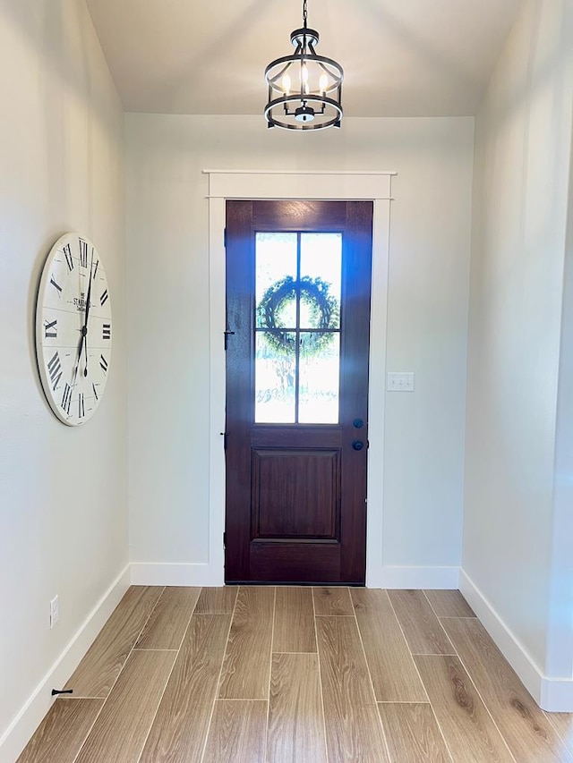 foyer featuring a notable chandelier