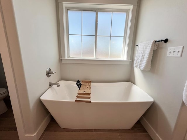 bathroom featuring a tub to relax in