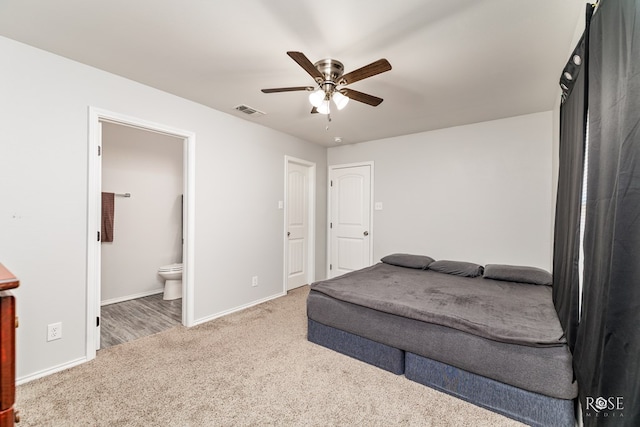 bedroom featuring baseboards, visible vents, a ceiling fan, connected bathroom, and carpet floors