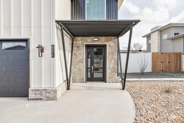 view of exterior entry with a garage