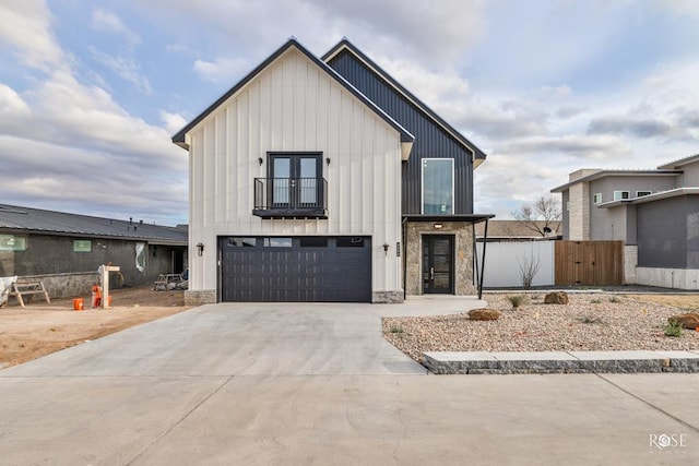 modern farmhouse with a balcony and a garage