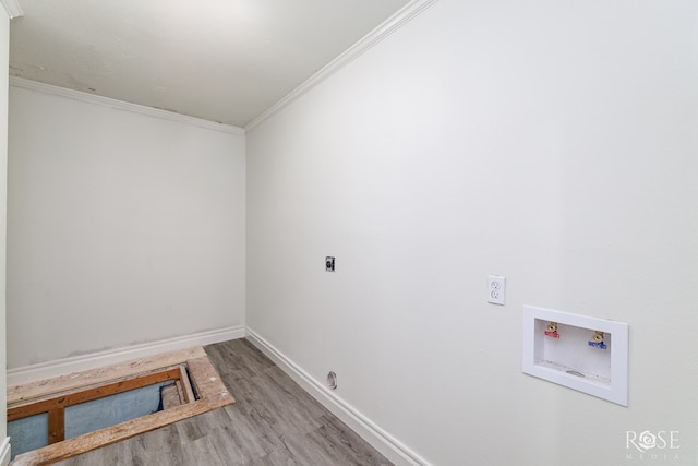 4815 Bowie St, San Angelo, TX 76903 - laundry area featuring hookup for an electric dryer, hookup for a washing machine, wood finished floors, crown molding, and baseboards