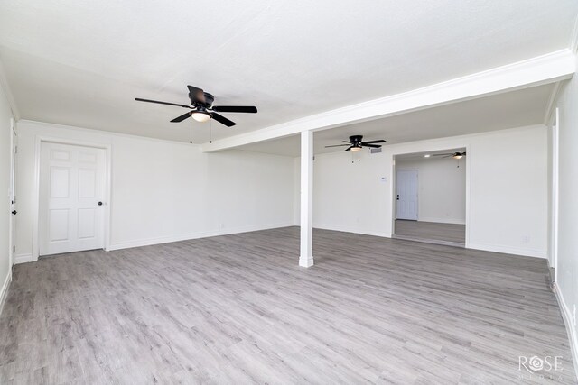4815 Bowie St, San Angelo, TX 76903 - unfurnished living room with wood finished floors, ceiling fan, and baseboards