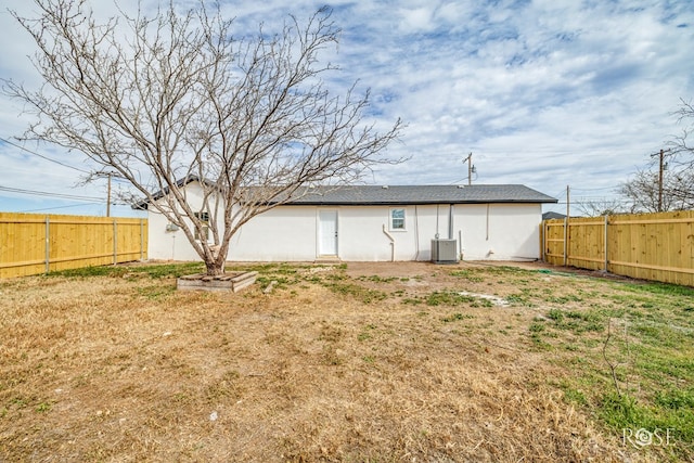 4815 Bowie St, San Angelo, TX 76903 - rear view of house with central AC and stucco siding