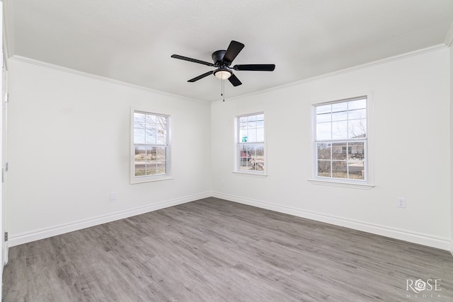 4815 Bowie St, San Angelo, TX 76903 - unfurnished room with ornamental molding, wood finished floors, ceiling fan, and baseboards