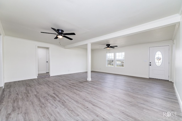 4815 Bowie St, San Angelo, TX 76903 - unfurnished living room featuring ceiling fan, wood finished floors, baseboards, and crown molding