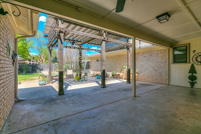 view of patio featuring a pergola and fence