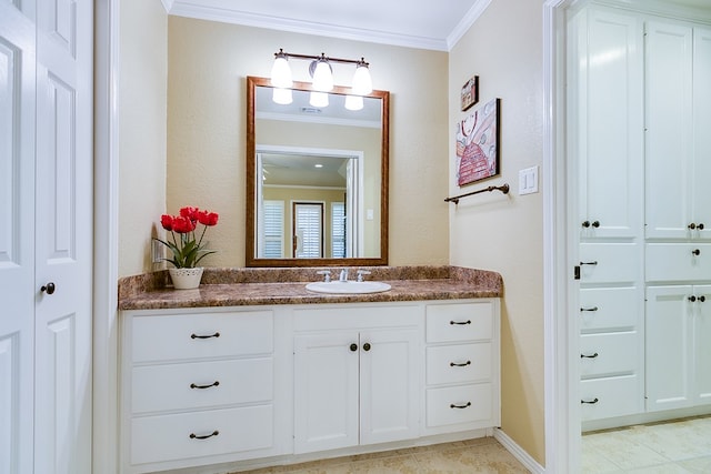 bathroom featuring a closet, vanity, and ornamental molding