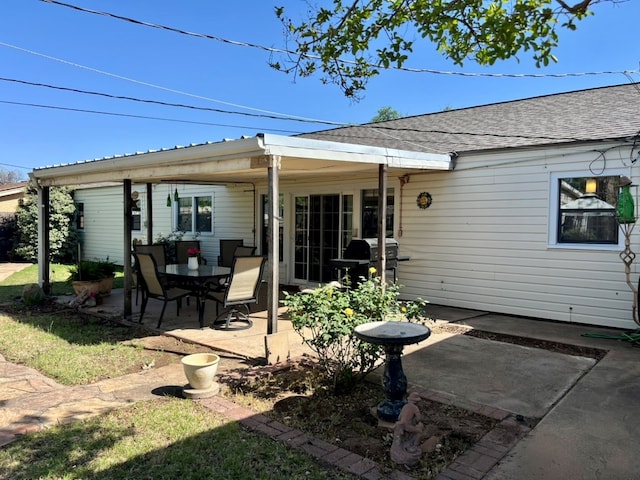 2708 A & M Ave, San Angelo, TX 76904 - back of property with a patio area and roof with shingles
