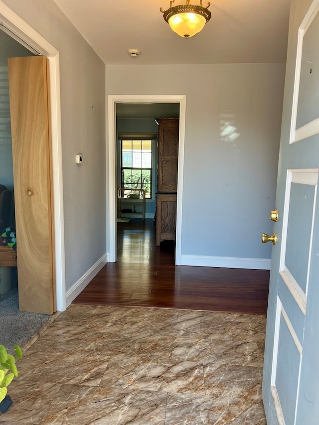 2708 A & M Ave, San Angelo, TX 76904 - hallway featuring baseboards and wood finished floors