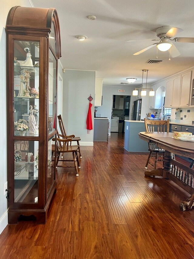2708 A & M Ave, San Angelo, TX 76904 - dining room featuring dark wood-style floors, a ceiling fan, and baseboards