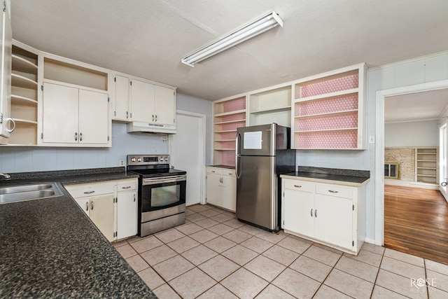 2609 W Beauregard Ave, San Angelo, TX 76901 - kitchen featuring open shelves, under cabinet range hood, white cabinetry, light tile patterned floors, and appliances with stainless steel finishes