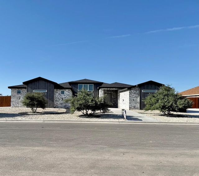 1609 Club House Ln, San Angelo, TX 76904 - view of front of house with stone siding and board and batten siding
