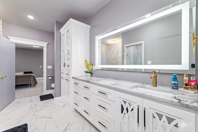 1609 Club House Ln, San Angelo, TX 76904 - full bath with vanity, toilet, connected bathroom, recessed lighting, and baseboards