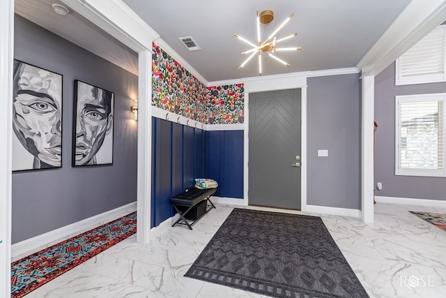 1609 Club House Ln, San Angelo, TX 76904 - foyer with marble look tile flooring, a chandelier, ornamental molding, a wainscoted wall, and baseboards