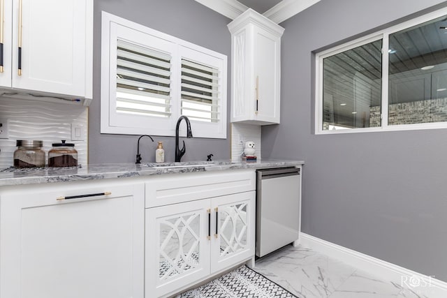 1609 Club House Ln, San Angelo, TX 76904 - bar area featuring a sink, light marble finish floors, dishwasher, baseboards, and ornamental molding