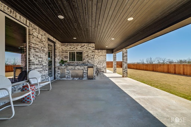 1609 Club House Ln, San Angelo, TX 76904 - view of patio with exterior kitchen