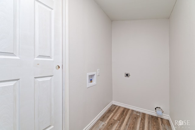 laundry area featuring electric dryer hookup, washer hookup, and light wood-type flooring