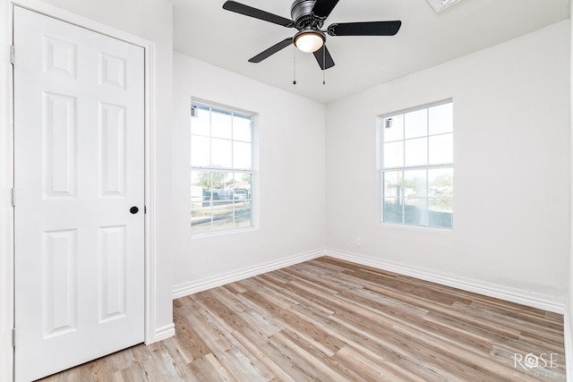 empty room featuring light hardwood / wood-style flooring and ceiling fan