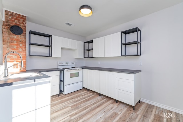 kitchen with white cabinetry, white range with electric cooktop, light hardwood / wood-style floors, and sink