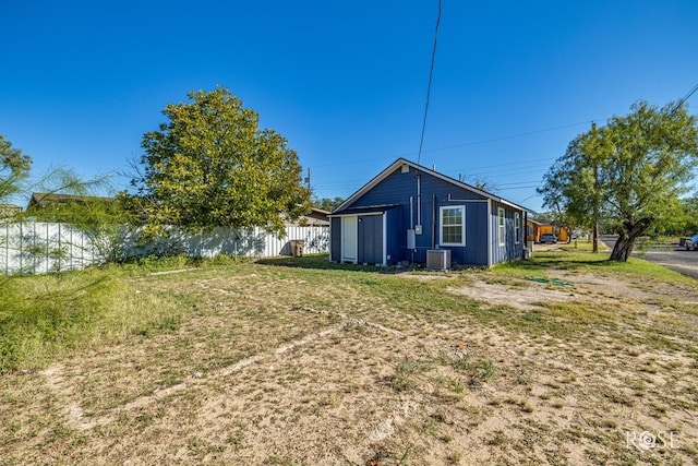 back of house with a water view and central air condition unit