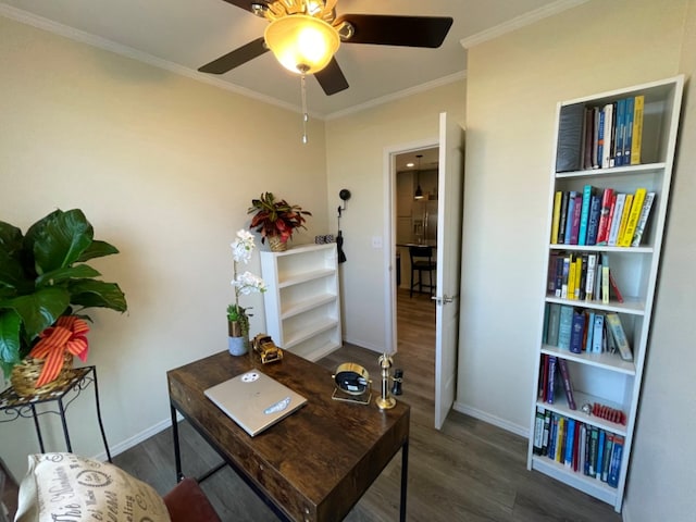 office area with a ceiling fan, crown molding, baseboards, and wood finished floors