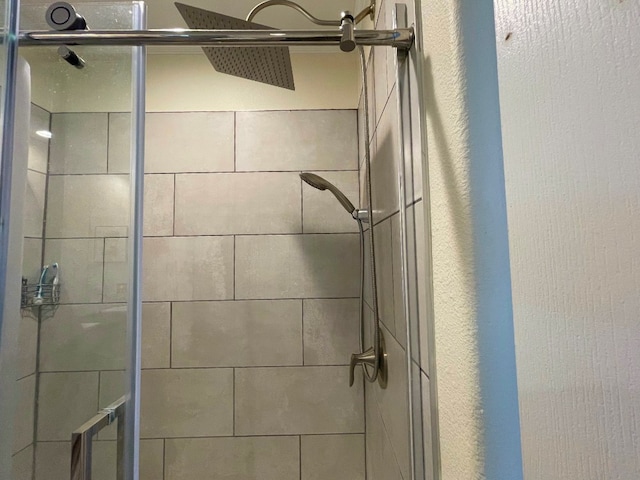 interior details with a shower stall