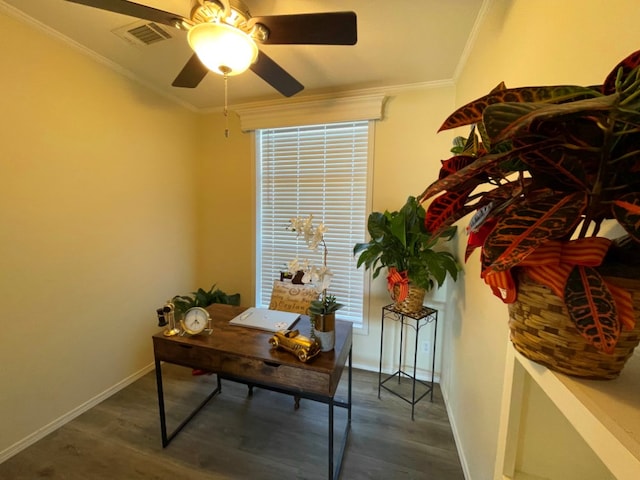 office space with crown molding, visible vents, ceiling fan, wood finished floors, and baseboards