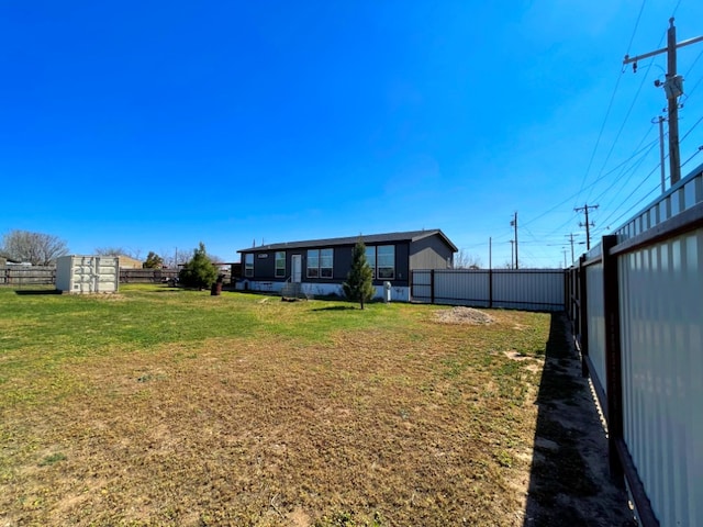 view of yard with a fenced backyard