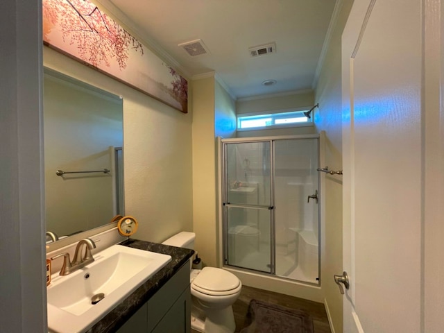 bathroom featuring ornamental molding, visible vents, and a shower stall