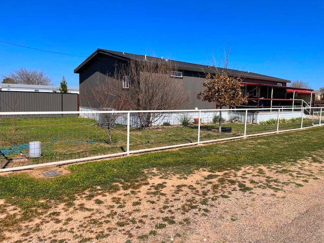 back of house featuring fence