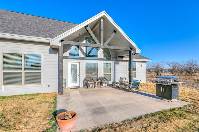 exterior space with a patio area and a lawn