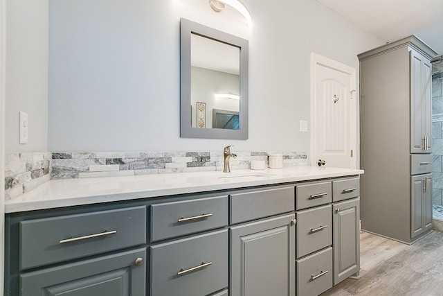 bathroom with vanity and hardwood / wood-style flooring