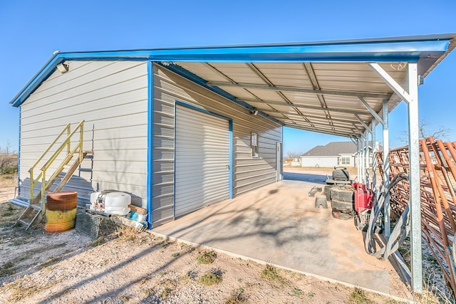 view of outbuilding with a carport