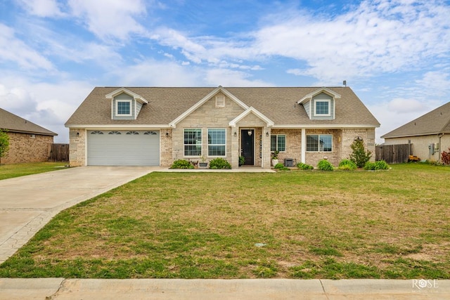 5988 Bridlewood Ct, San Angelo, TX 76904 - view of front of property with fence, driveway, brick siding, a front yard, and a garage