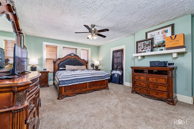 bedroom with light carpet, a textured ceiling, and ceiling fan