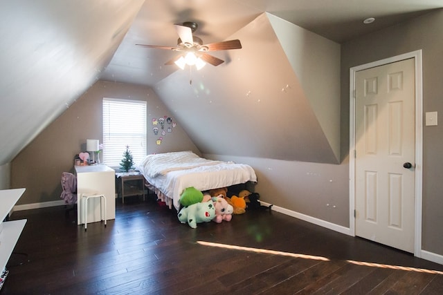 bedroom with ceiling fan, dark hardwood / wood-style flooring, and vaulted ceiling