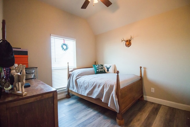 bedroom featuring lofted ceiling, dark hardwood / wood-style floors, and ceiling fan