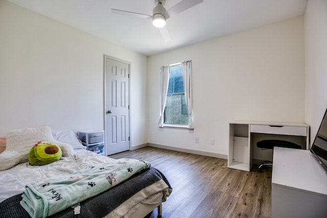 1106 Gregory Dr, San Angelo, TX 76905 - bedroom featuring wood finished floors, a ceiling fan, and an office area