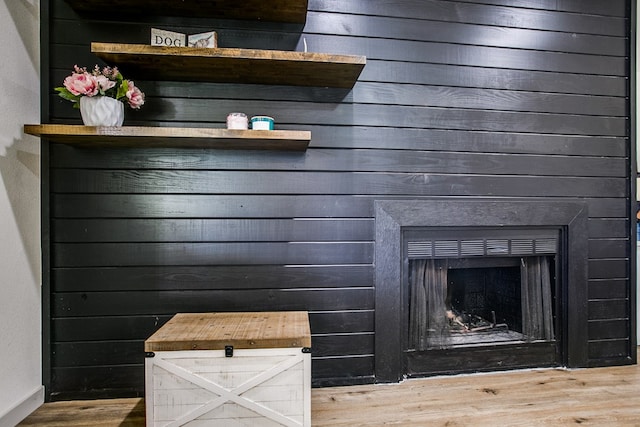 1106 Gregory Dr, San Angelo, TX 76905 - detailed view of wood finished floors and a fireplace